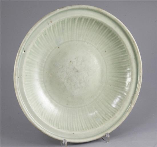 A Chinese Longquan celadon dish, 15th / 16th century, diameter 27cm, crack to rim, wear to glaze